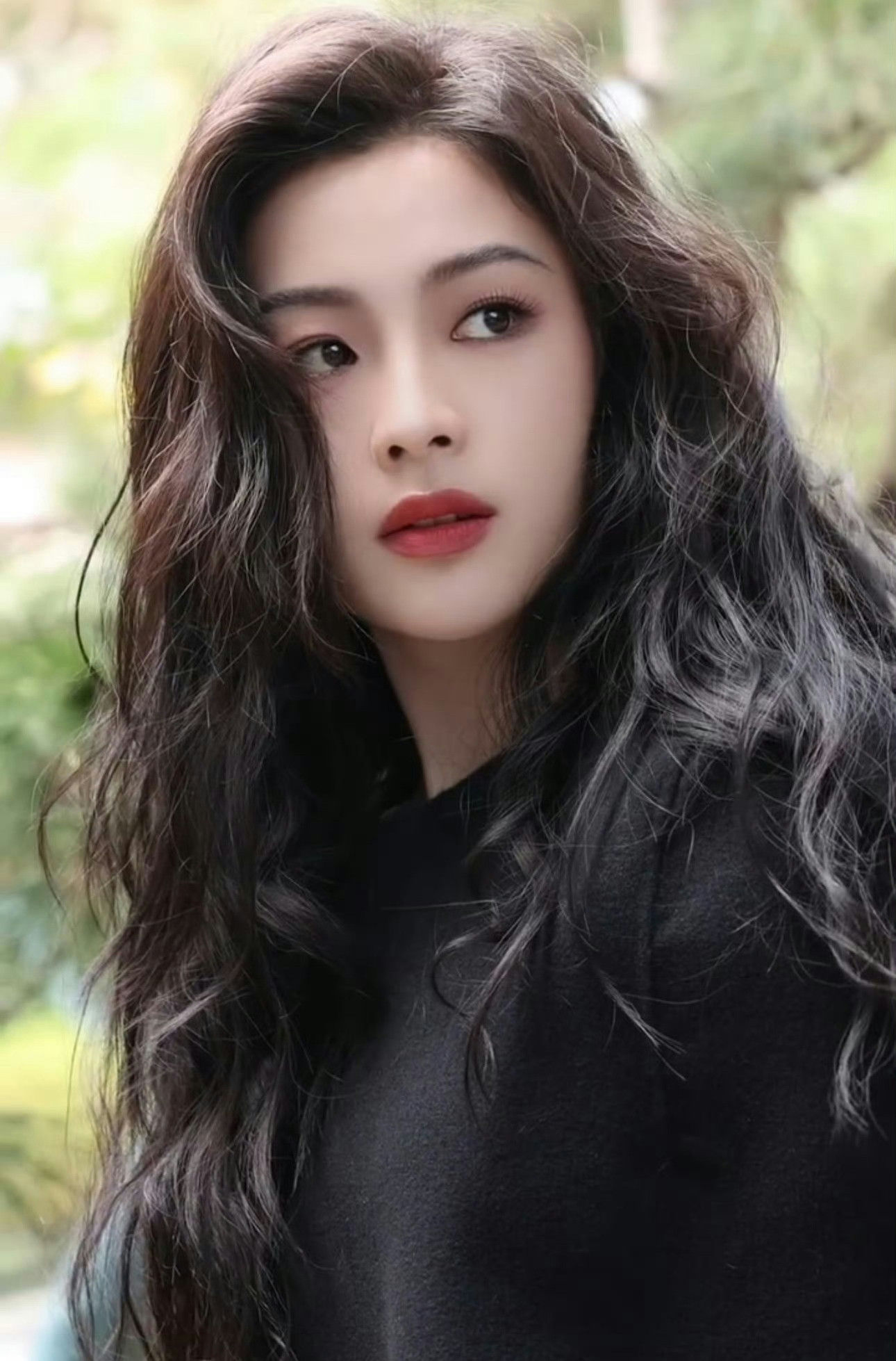 people-Liu Yifei-long dark hair-A-red lipstick-A-black clothing-B-outdoors blurred background-C