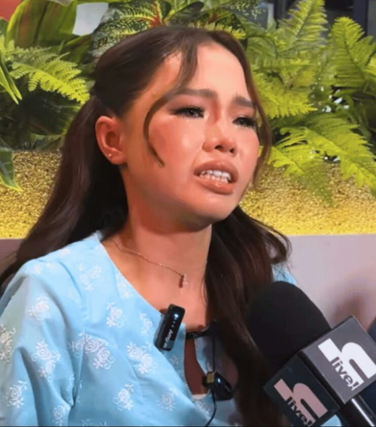people-Filipina singer and actress-Darren-emotional-interview-light blue embroidered top-microphone