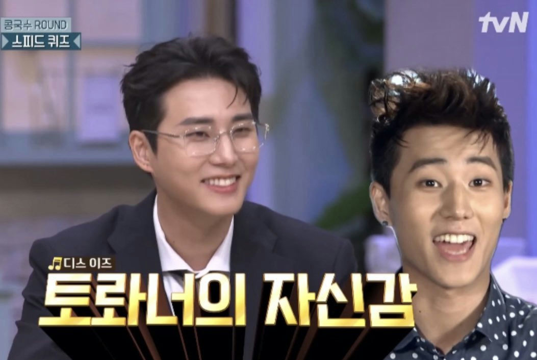 people-Two Korean male celebrities-A-Smiling man in glasses-A-Man with spiky hair and an open mouth-C-TV show subtitle