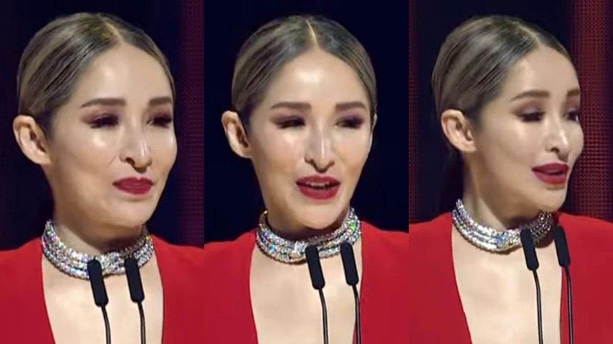 people-Kimberley Chen-speaking at an event-A-red dress-B-diamond choker-C-stage lighting