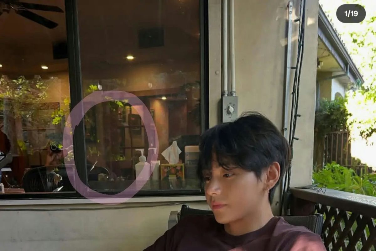people-V (Kim Taehyung)-sitting-window reflection-outdoor setting-hand sanitizer