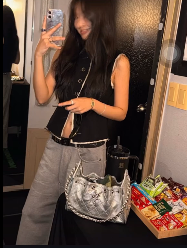 people-Jennie Kim-mirror selfie-A-black sleeveless vest-B-wide-leg grey pants-C-silver quilted Chanel bag