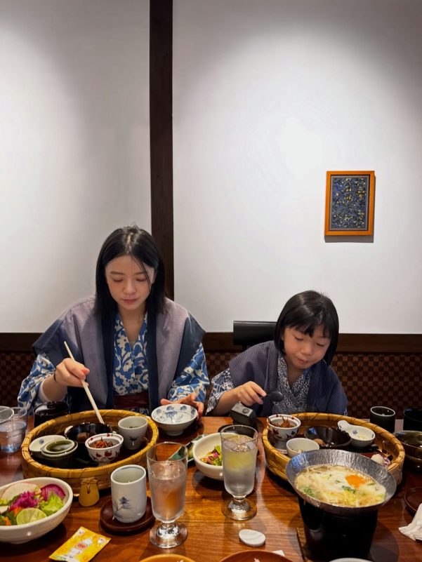 people-two young females-dining-Japanese meal-yukata-eating-traditional Japanese inn