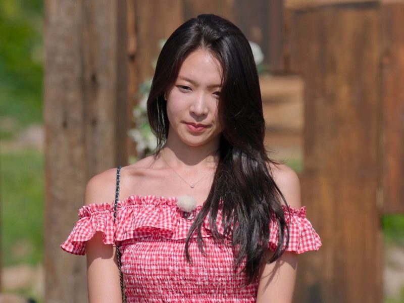 people-Woman-Red Gingham Off-the-Shoulder Top-Long Dark Hair-Outdoor Setting-Subtle Jewelry