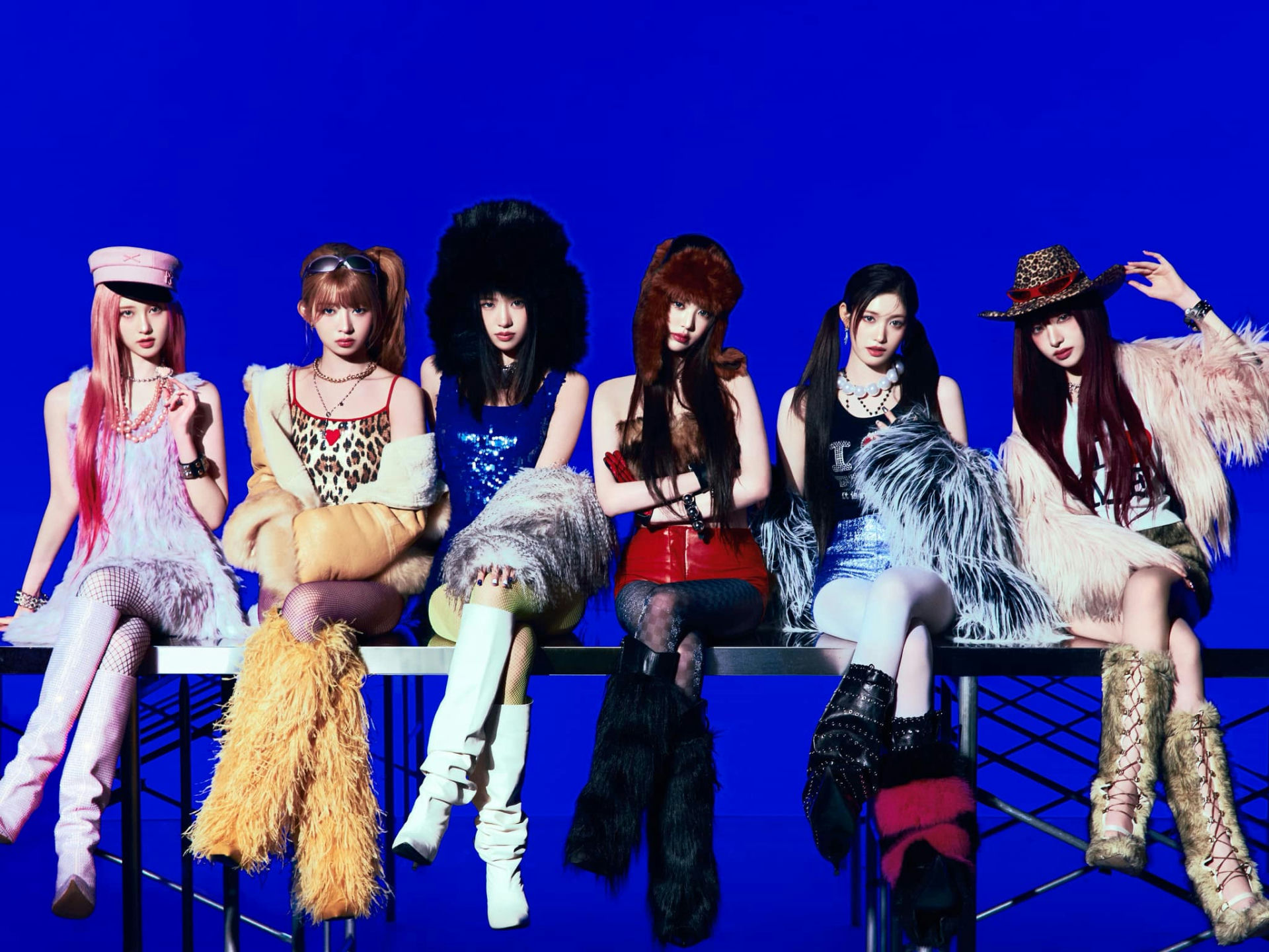 K-pop-group-NewJeans-fashion-fur-boots-bright-blue-background