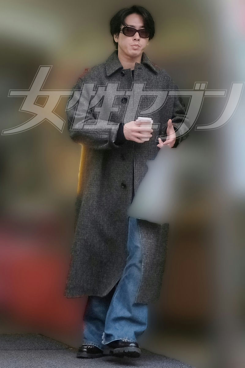 people-Tatsuya Ueda-Japanese male celebrity-long grey tweed coat-dark sunglasses-blue jeans-chunky black shoes