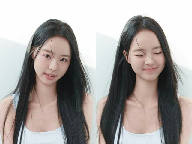 people-Hanni NewJeans-young woman-A-long black hair-A-white tank top-A-natural lighting