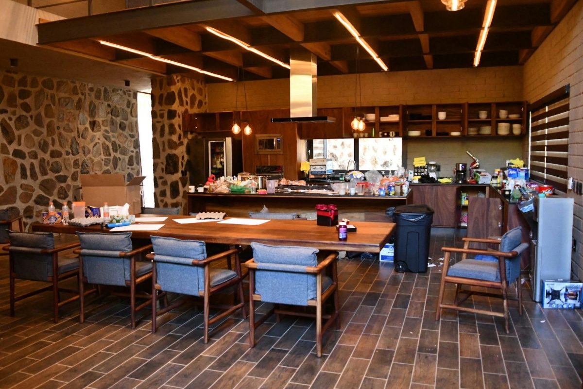 people-N/A-indoor-A-dining-area-A-kitchen-A-stone-wall-B-wood-ceiling-B-dark-wood-floor-C