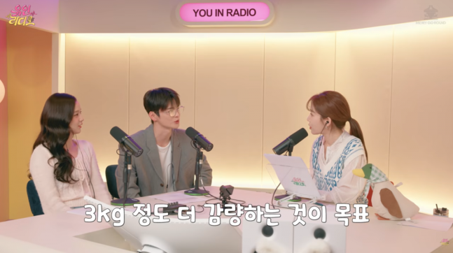 people-Cha Eun-woo-and-two-other-people-radio-show-broadcast-Korean-subtitles-A-sitting-at-a-desk-with-microphones-B-female-host-C-female-guest