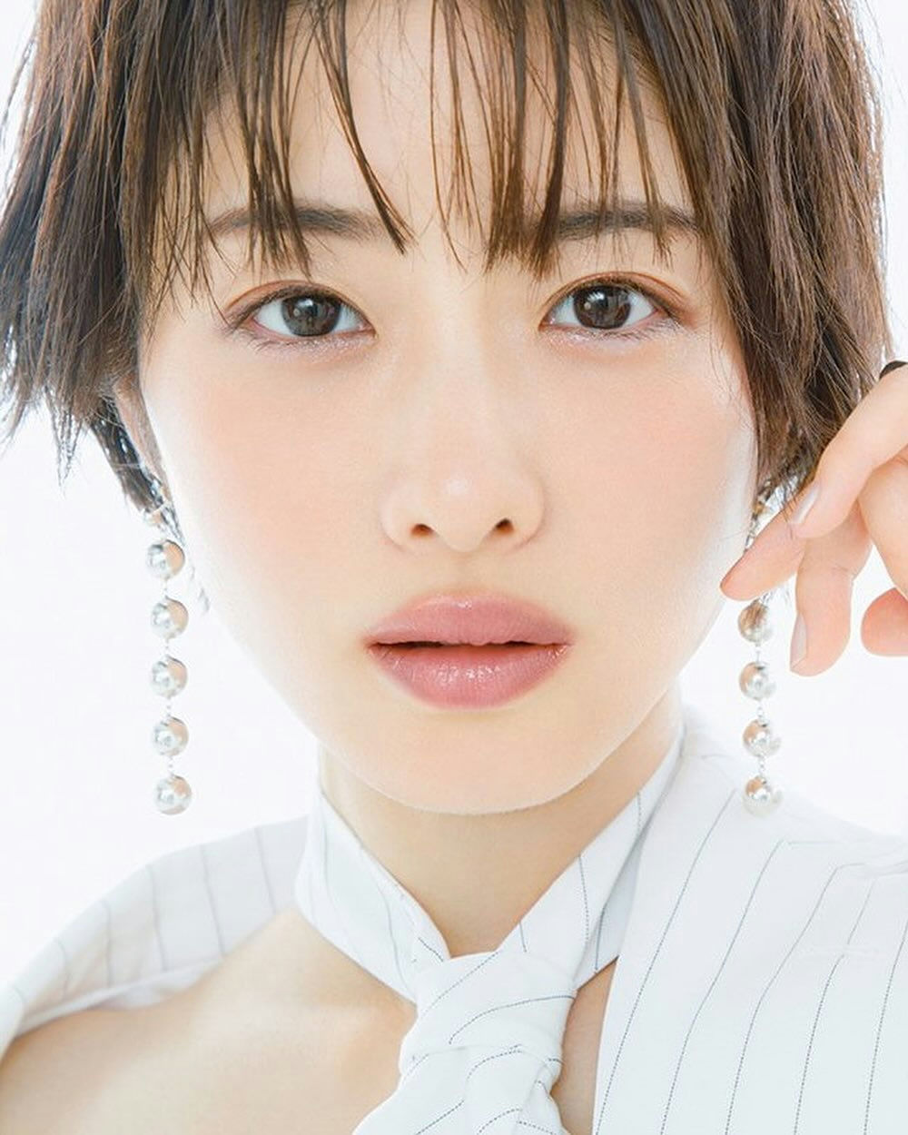 people-Japanese actress-A-short brown hair-A-pinstripe white blouse-A-long dangling silver earrings-A-minimal makeup