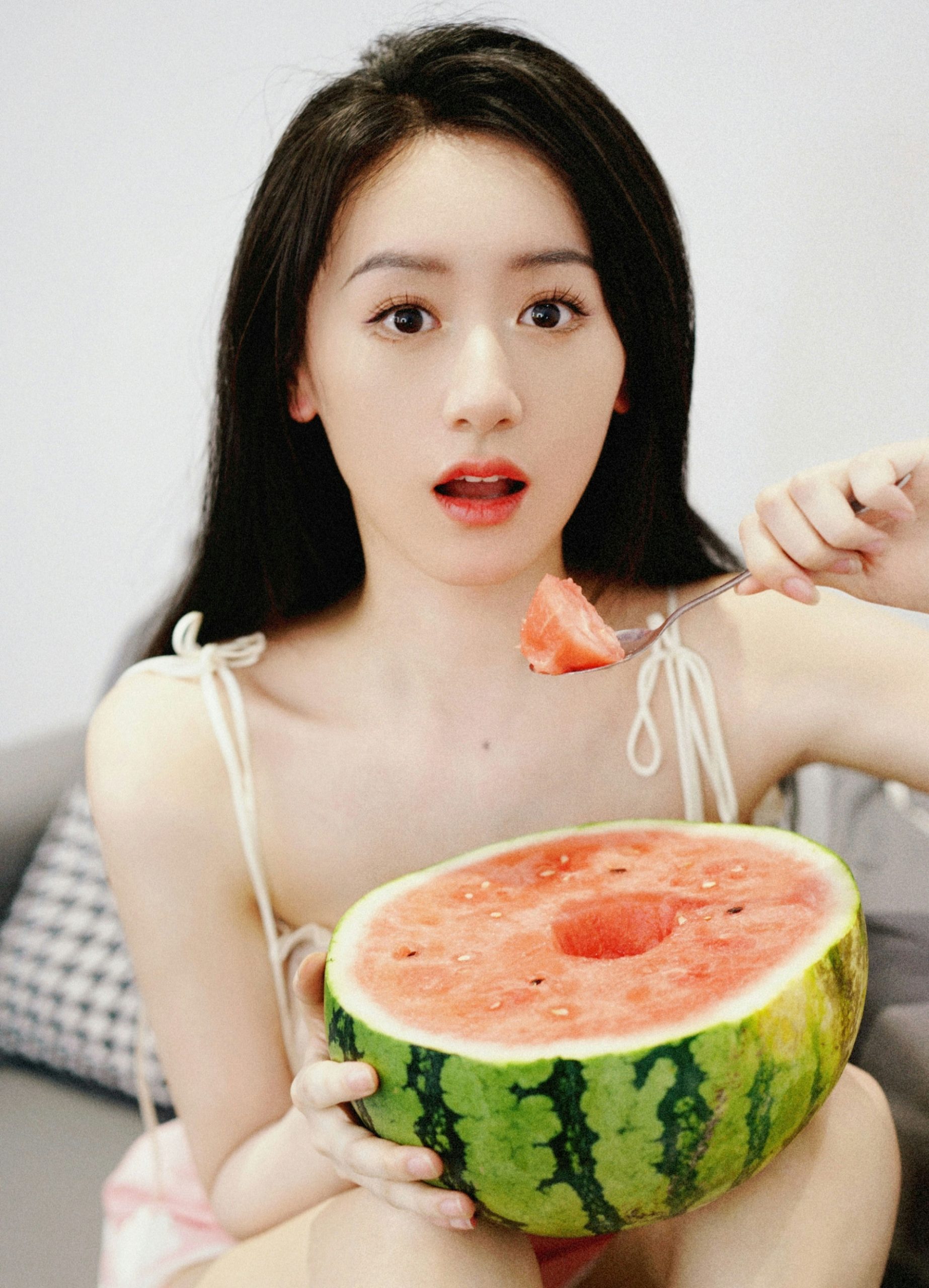 people-Young East Asian woman-A-eating watermelon-A-holding watermelon-B-summer fruit-C-light makeup