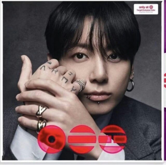 people-Jungkook (BTS)-portrait-A-dark hair-A-facial piercings (lip ring)-B-rings and hand tattoos (ARMY)-C-Target exclusive branding