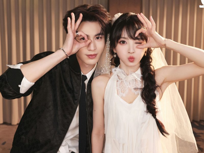 people-Chinese celebrity couple-A-wedding attire-A-playful pose-B-Gucci jacket-C-white bridal dress