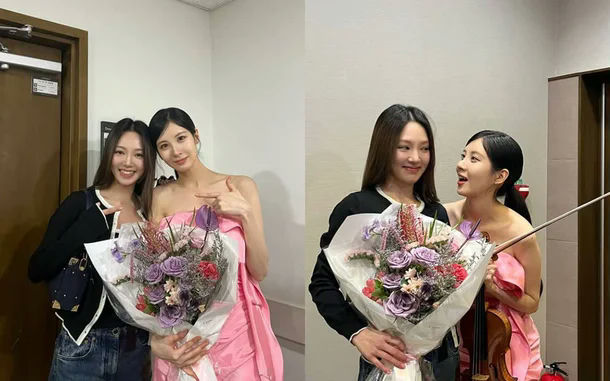 people-Two women-A-Holding flowers-B-Posing-C-One holding a violin