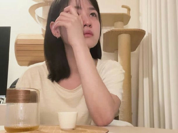 people-young woman-tea ceremony-indoor-cat tree-sadness