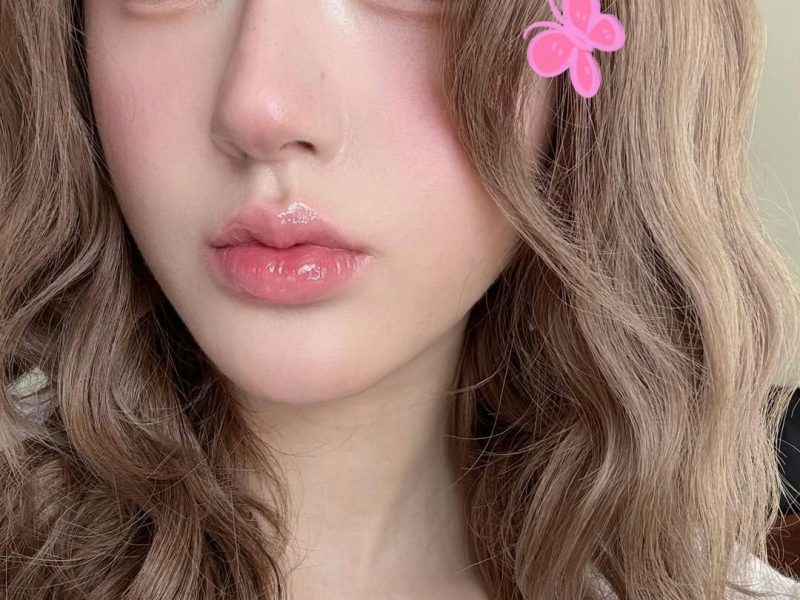 people-K-pop-idol-A-long-brown-wavy-hair-B-glossy-pink-lips-C-pink-butterfly-sticker