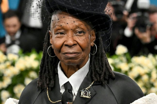people-Whoopi Goldberg-A-black suit-A-fascinator hat with veil-B-dreadlocks-C-hoop earrings