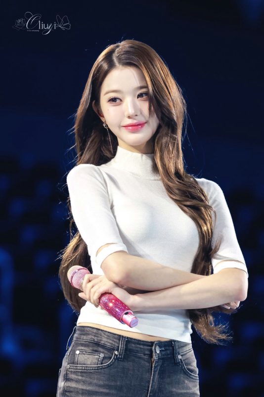 people-Jang Wonyoung-idol-A-white turtleneck-B-dark jeans-C-sparkly pink microphone