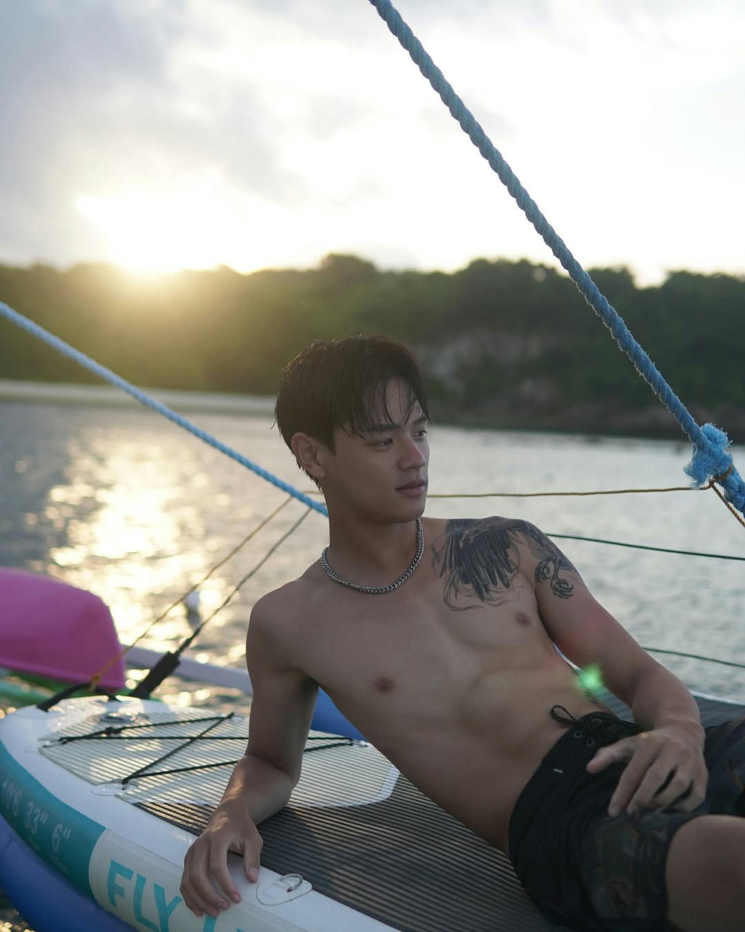people-young man-A-beachwear-B-tattoo-C-sunset