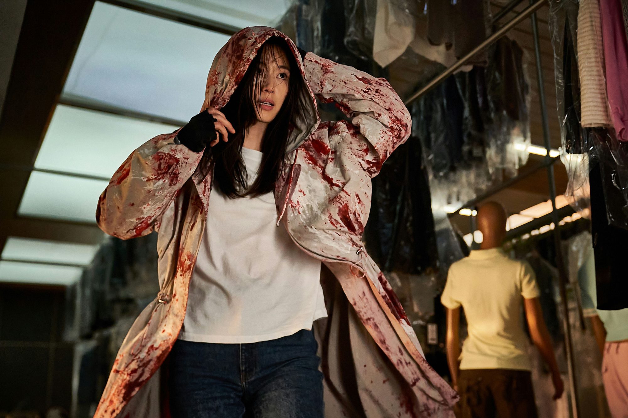 people-Jeon Jong-seo-A-blood-splattered-coat-A-hooded-A-intense-expression-A-dry-cleaners-setting