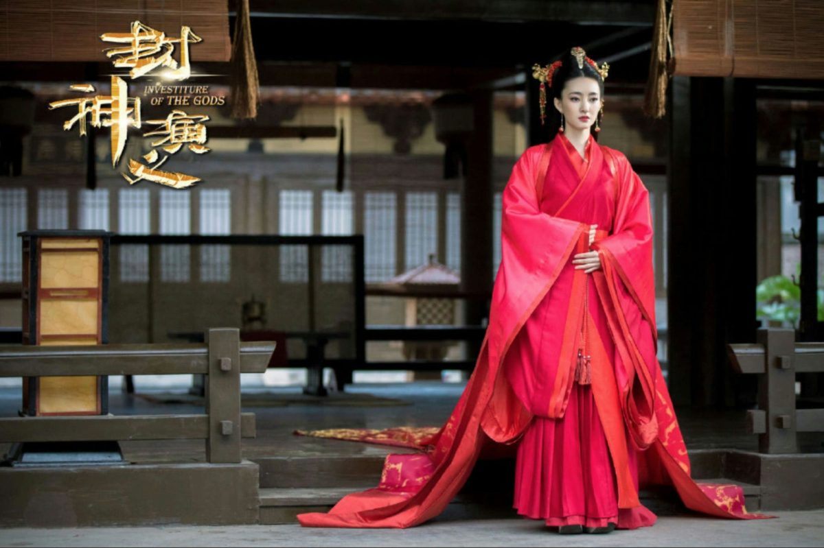 people-Zhang Xinyi-Chinese actress-attire-traditional Hanfu-color-vibrant red-setting-ancient Chinese architecture-title card-Investiture of the Gods