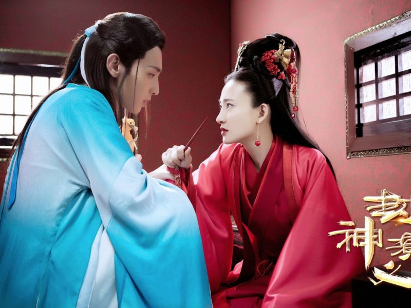 people-Two actors in traditional Chinese costume-A-Intense gaze-A-Red and blue robes-B-Chinese characters/logo-C-Dramatic lighting